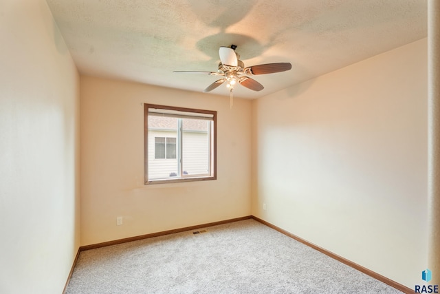 605 N Daisy Ave, Sioux Falls, SD 57107 - unfurnished room with a ceiling fan, carpet floors, baseboards, and a textured ceiling