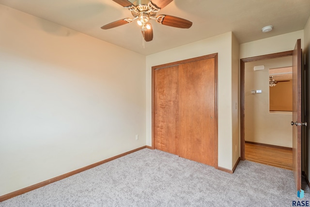 605 N Daisy Ave, Sioux Falls, SD 57107 - unfurnished bedroom featuring carpet, a closet, baseboards, and a ceiling fan