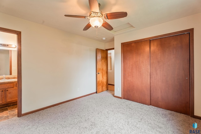 605 N Daisy Ave, Sioux Falls, SD 57107 - unfurnished bedroom with light carpet, a sink, a closet, ensuite bathroom, and baseboards