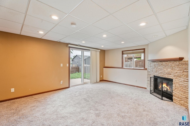 605 N Daisy Ave, Sioux Falls, SD 57107 - unfurnished living room with carpet flooring, baseboards, a fireplace, a paneled ceiling, and recessed lighting