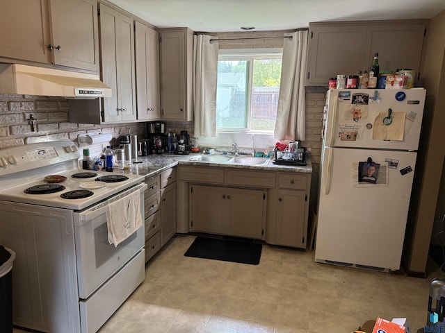 822 S Jessica Ave, Sioux Falls, SD 57103 - kitchen featuring white appliances, under cabinet range hood, a sink, decorative backsplash, and light countertops