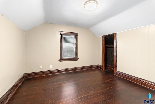 1530 W 10th St, Sioux Falls, SD 57104 - additional living space with dark wood finished floors, vaulted ceiling, and baseboards