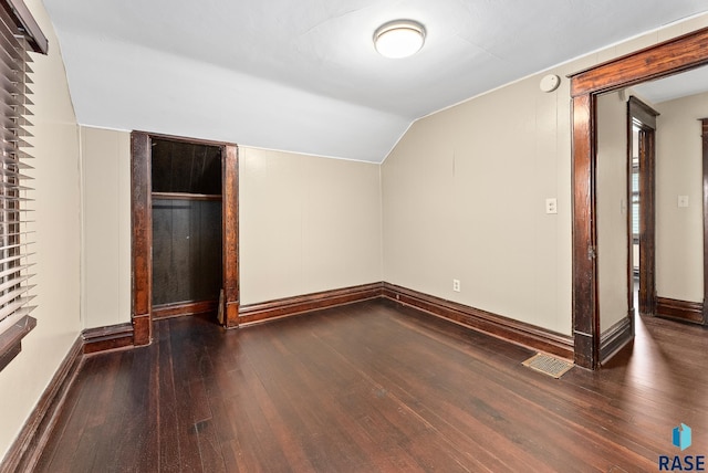 1530 W 10th St, Sioux Falls, SD 57104 - bonus room featuring wood-type flooring, vaulted ceiling, and baseboards