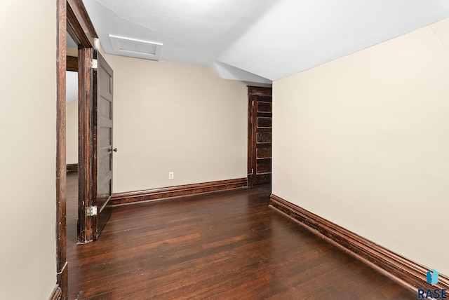 1530 W 10th St, Sioux Falls, SD 57104 - unfurnished room featuring vaulted ceiling, wood finished floors, and baseboards