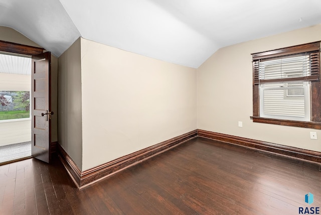 1530 W 10th St, Sioux Falls, SD 57104 - additional living space with vaulted ceiling, baseboards, and dark wood finished floors