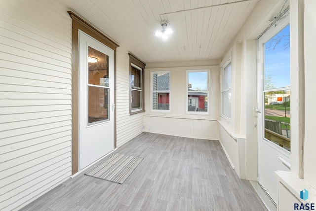 1530 W 10th St, Sioux Falls, SD 57104 - unfurnished sunroom featuring wood finished floors and wooden ceiling