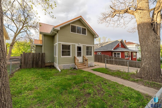 1530 W 10th St, Sioux Falls, SD 57104 - rear view of house featuring entry steps and metal roof