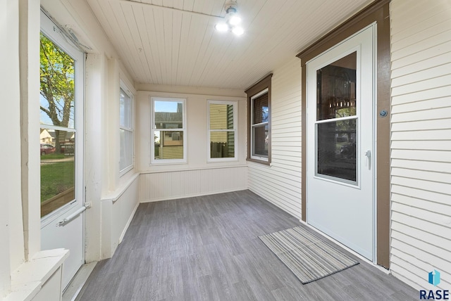 1530 W 10th St, Sioux Falls, SD 57104 - unfurnished sunroom with wood finished floors, plenty of natural light, and wooden ceiling