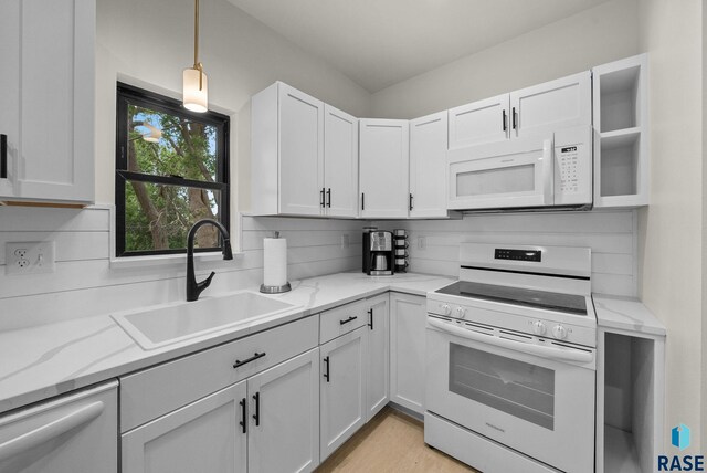 1709 S Duluth Ave, Sioux Falls, SD 57105 - kitchen with white appliances, a sink, white cabinets, and light stone counters