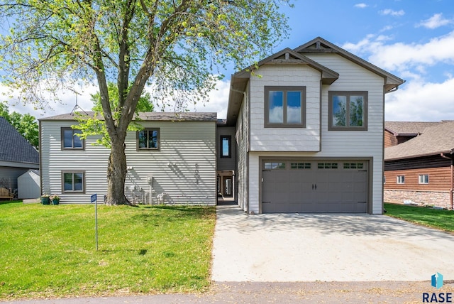 6604 Peninsula Pt, Wentworth, SD 57075 - view of front of property featuring an attached garage, a front yard, and concrete driveway