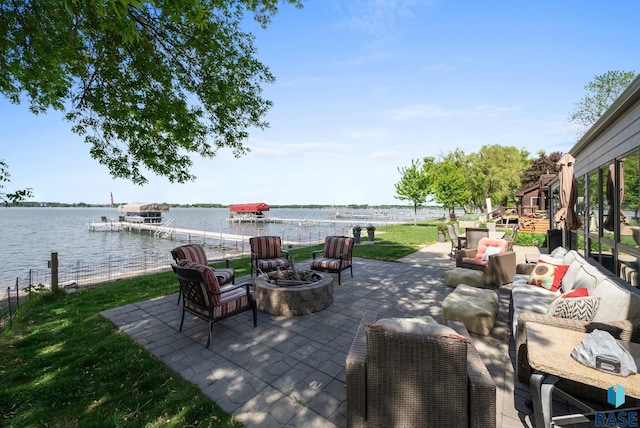 6604 Peninsula Pt, Wentworth, SD 57075 - view of patio featuring an outdoor living space with a fire pit and a water view