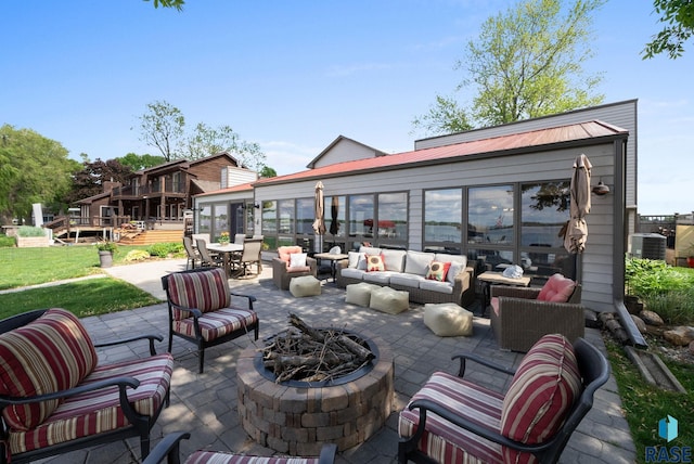 6604 Peninsula Pt, Wentworth, SD 57075 - view of patio with an outdoor living space with a fire pit, cooling unit, and outdoor dining space