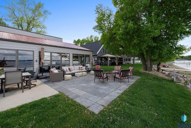 6604 Peninsula Pt, Wentworth, SD 57075 - view of patio with an outdoor living space with a fire pit