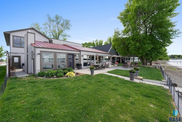 6604 Peninsula Pt, Wentworth, SD 57075 - back of property featuring a patio area, metal roof, and a standing seam roof