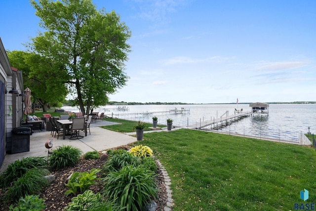 6604 Peninsula Pt, Wentworth, SD 57075 - view of grassy yard with a water view, a patio area, and a boat dock