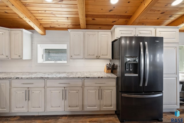 6604 Peninsula Pt, Wentworth, SD 57075 - kitchen with black fridge with ice dispenser, wooden ceiling with exposed beams, white cabinets, light stone countertops, and dark wood-style flooring