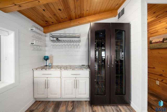 6604 Peninsula Pt, Wentworth, SD 57075 - indoor dry bar featuring wood ceiling, wood walls, dark wood-type flooring, and high end refrigerator