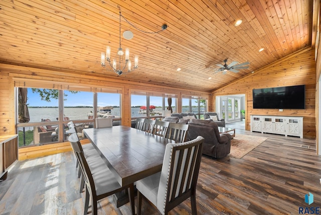 6604 Peninsula Pt, Wentworth, SD 57075 - dining room with high vaulted ceiling, wooden walls, healthy amount of natural light, dark wood-style floors, and a chandelier