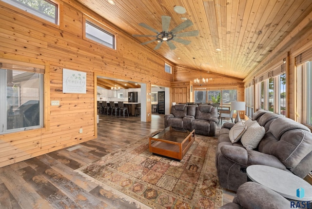 6604 Peninsula Pt, Wentworth, SD 57075 - living area with wood walls, plenty of natural light, a chandelier, wood finished floors, and ceiling fan