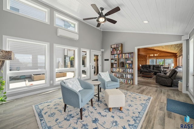 6604 Peninsula Pt, Wentworth, SD 57075 - living area with vaulted ceiling, a wall unit AC, wood ceiling, a ceiling fan, and wood finished floors