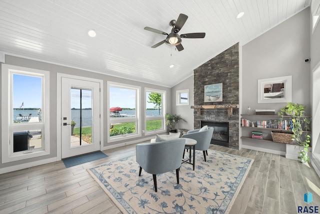6604 Peninsula Pt, Wentworth, SD 57075 - living room with a fireplace, wooden ceiling, vaulted ceiling, light wood-style flooring, and a ceiling fan