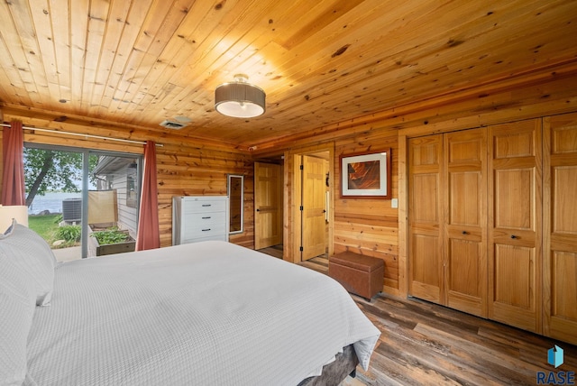 6604 Peninsula Pt, Wentworth, SD 57075 - bedroom with wooden walls, wood finished floors, wood ceiling, and a closet