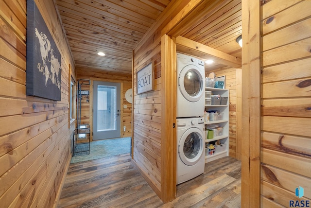 6604 Peninsula Pt, Wentworth, SD 57075 - laundry area featuring stacked washer / dryer, wood walls, wood ceiling, and wood finished floors