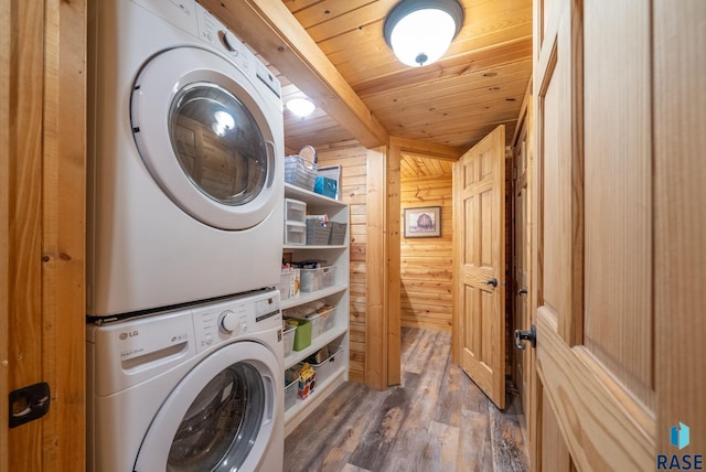 6604 Peninsula Pt, Wentworth, SD 57075 - laundry area with stacked washing machine and dryer, wood finished floors, wood ceiling, and wood walls