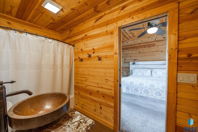 6604 Peninsula Pt, Wentworth, SD 57075 - bathroom with wooden walls, a ceiling fan, wooden ceiling, and curtained shower