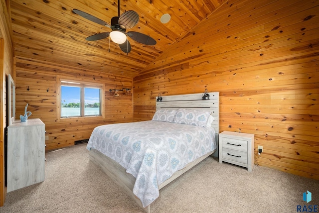 6604 Peninsula Pt, Wentworth, SD 57075 - bedroom featuring light carpet, lofted ceiling, wood ceiling, wooden walls, and ceiling fan