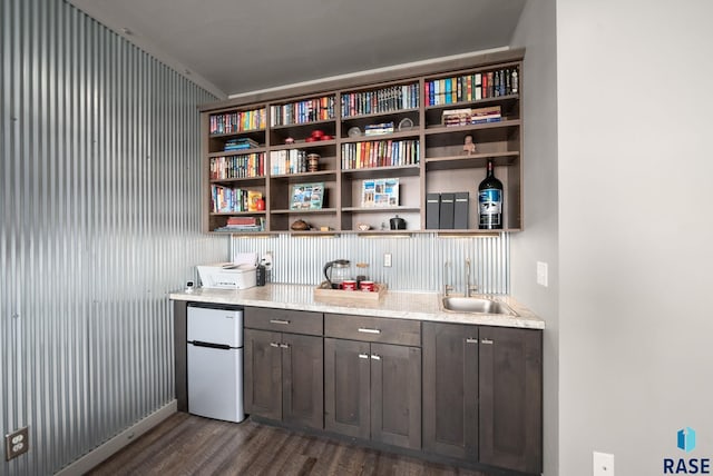 6604 Peninsula Pt, Wentworth, SD 57075 - indoor wet bar with freestanding refrigerator and dark wood-style flooring