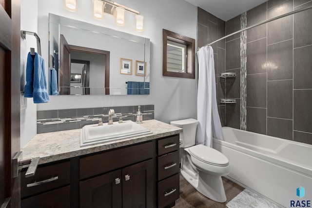 6604 Peninsula Pt, Wentworth, SD 57075 - bathroom featuring vanity, toilet, shower / bathtub combination with curtain, and wood finished floors