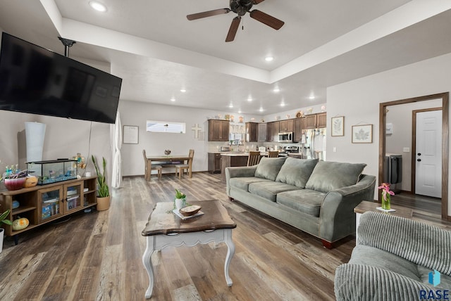 5205 S Eastwind Ave, Sioux Falls, SD 57108 - living room with a ceiling fan, wood finished floors, a raised ceiling, and recessed lighting