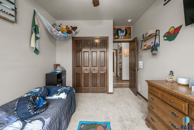 5205 S Eastwind Ave, Sioux Falls, SD 57108 - bedroom with light colored carpet, a closet, and a ceiling fan