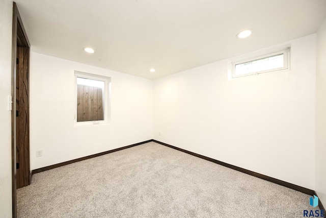 121 S Elm St, Lennox, SD 57039 - carpeted empty room with recessed lighting and baseboards
