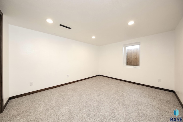 121 S Elm St, Lennox, SD 57039 - spare room with carpet flooring, baseboards, and recessed lighting