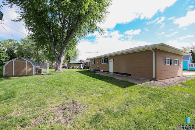 121 S Elm St, Lennox, SD 57039 - view of grassy yard featuring central AC unit