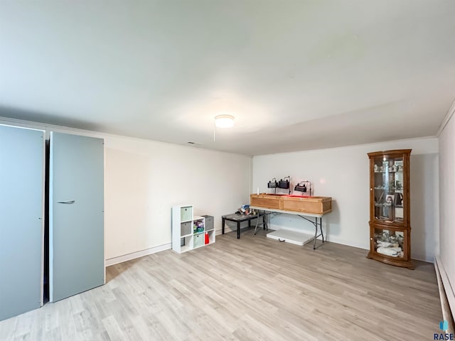 101 N Pipestone St Unit 3, Brandon, SD 57005 - office featuring light wood-style floors, a baseboard radiator, and baseboards