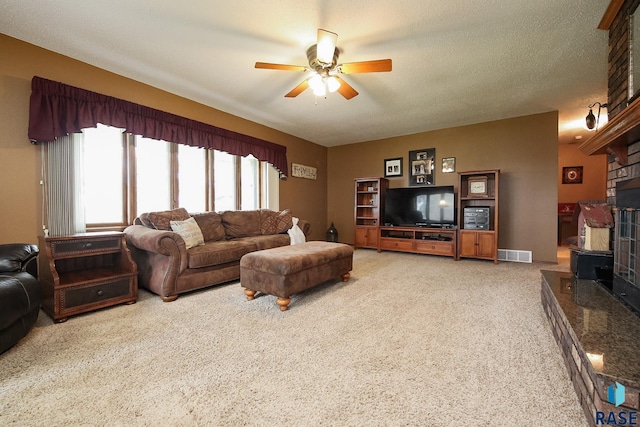 48224 266th St, Brandon, SD 57005 - living room featuring a brick fireplace, light colored carpet, and ceiling fan