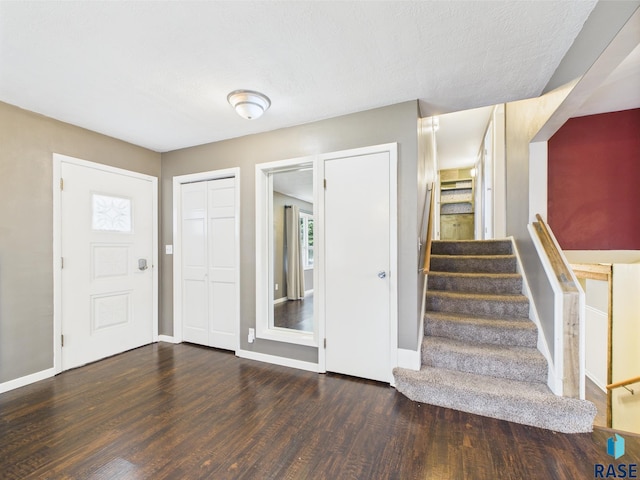 105 S Elm St, Lennox, SD 57039 - foyer entrance with wood finished floors, baseboards, and stairs