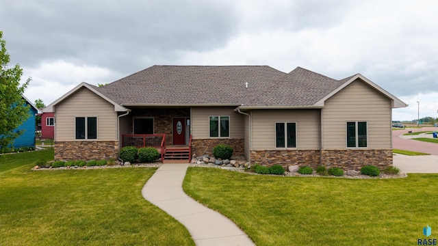 2601 N Devon Ave, Tea, SD 57064 - craftsman house with stone siding, covered porch, a shingled roof, and a front lawn
