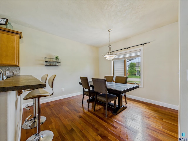2601 N Devon Ave, Tea, SD 57064 - dining space with dark wood-style floors and baseboards