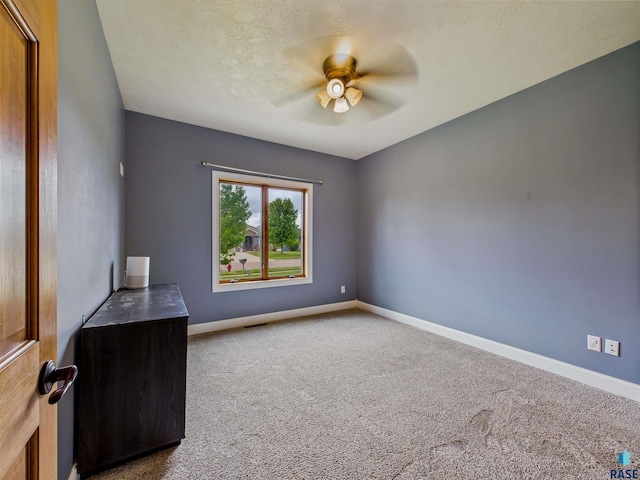 2601 N Devon Ave, Tea, SD 57064 - empty room featuring a ceiling fan, carpet, and baseboards