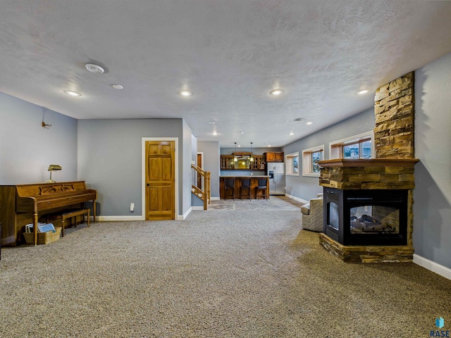 2601 N Devon Ave, Tea, SD 57064 - carpeted living room with baseboards, a fireplace, and recessed lighting