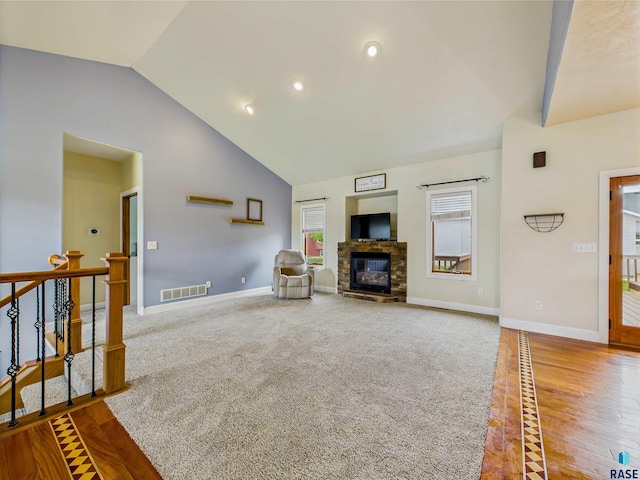 2601 N Devon Ave, Tea, SD 57064 - living area with baseboards, a fireplace, recessed lighting, high vaulted ceiling, and wood finished floors