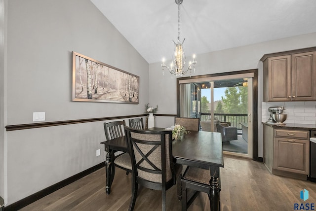 3909 E Shepherd St, Sioux Falls, SD 57103 - dining space featuring a chandelier, dark wood-style floors, lofted ceiling, and baseboards