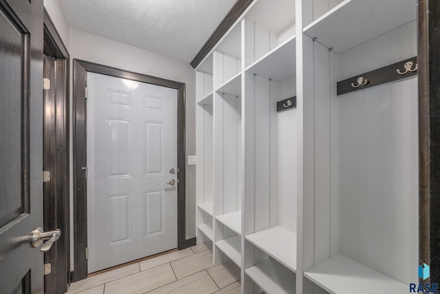 3909 E Shepherd St, Sioux Falls, SD 57103 - mudroom with light tile patterned floors and a textured ceiling