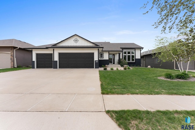 3909 E Shepherd St, Sioux Falls, SD 57103 - view of front of property with an attached garage, a front yard, concrete driveway, and board and batten siding