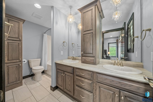 3909 E Shepherd St, Sioux Falls, SD 57103 - bathroom with a chandelier, double vanity, a shower with shower curtain, and toilet