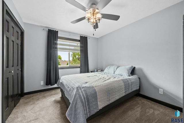 3909 E Shepherd St, Sioux Falls, SD 57103 - bedroom with dark carpet, baseboards, a closet, and a ceiling fan
